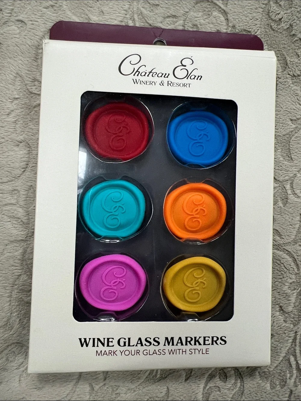 Château Élan branded wine glass markers feature a functional wax seal design